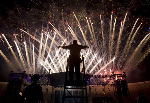 Kim Raff | The Salt Lake Tribune
A conductor for the Stadium of Fire Choir directs during the Stadium of Fire fireworks display at the LaVell Edwards Stadium in Provo, Utah on July 4, 2012.