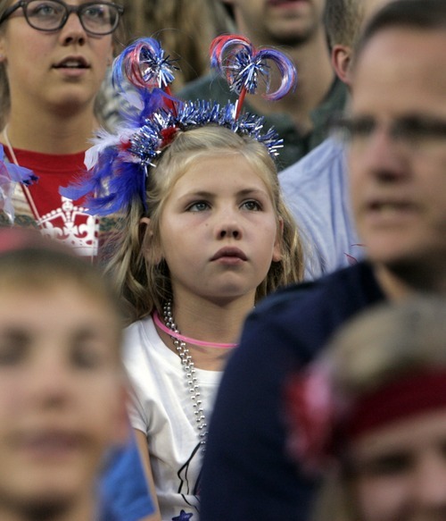 Kim Raff | The Salt Lake Tribune
A girl watches as the Stadium of Fire begins at the LaVell Edwards Stadium in Provo, Utah on July 4, 2012. Host Alex Boye