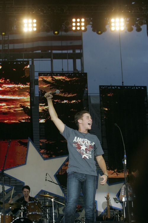 Kim Raff | The Salt Lake Tribune
Scotty McCreery performs during the Stadium of Fire at the LaVell Edwards Stadium in Provo, Utah on July 4, 2012.