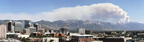 Lennie Mahler  |  The Salt Lake Tribune
Smoke billows from a fire near Alpine seen from downtown Salt Lake City on Tuesday, July 3, 2012.