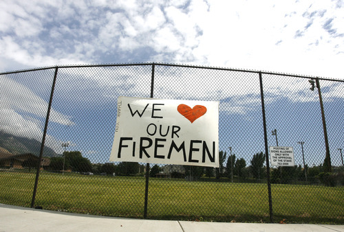 Rick Egan  | The Salt Lake Tribune 

A sign thanking the fire fighters was posted on a playground in Alpine. Thursday, July 5, 2012.
