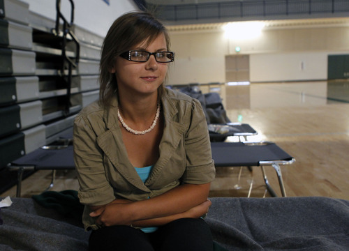 Al Hartmann  |  The Salt Lake Tribune  
Anita Christensen sits on her bunk at the  Red Cross shelter-evacuation center at Timberline Middle School in Alpine.  She's been there since Tuesday because her home is still under evacuation order due to the Alpine fire.