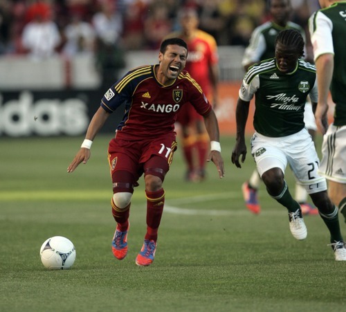Kim Raff | The Salt Lake Tribune
Real Salt Lake player Javier Morales reacts to being tripped up by Portland Timbers player Diego Chara at Rio Tinto Stadium in Sandy, Utah on July 7, 2012.