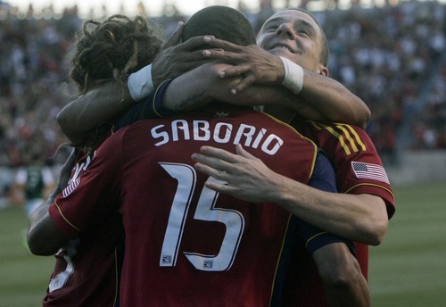 Kim Raff | The Salt Lake Tribune
Real Salt Lake player Alvaro Saborio celebrates with his teammates after scoring a hat trick against Portland Timbers at Rio Tinto Stadium in Sandy, Utah on July 7, 2012.  Real went on to win the game 3-0.