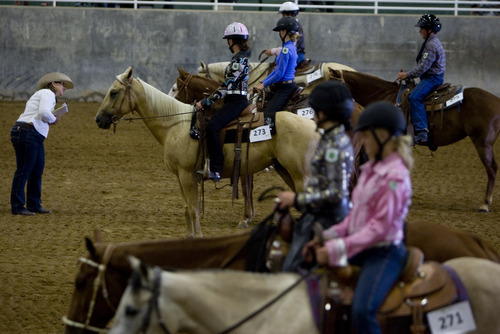 Kim Raff | The Salt Lake Tribune
Riders compete in the western horsemanship training during the 4-H two handed show at the South Jordan Equestrian Park in South Jordan, Utah on July 6, 2012.  This year marks the 100th anniversary of 4-H in Utah.