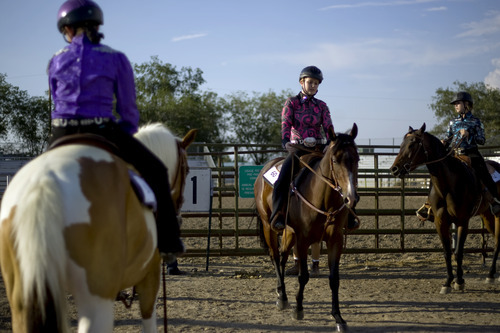 Kim Raff | The Salt Lake Tribune
McKenzie Sanders rides Deal out of the ring during the 4-H Horse Show at the South Jordan Equestrian Park in South Jordan, Utah on July 6, 2012.  This year marks the 100th anniversary of 4-H in Utah.