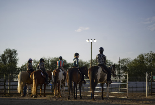 Kim Raff | The Salt Lake Tribune
Riders wait to compete in the horse trail course during the 4-H Horse Show at the South Jordan Equestrian Park in South Jordan, Utah on July 6, 2012.  This year marks the 100th anniversary of 4-H in Utah.