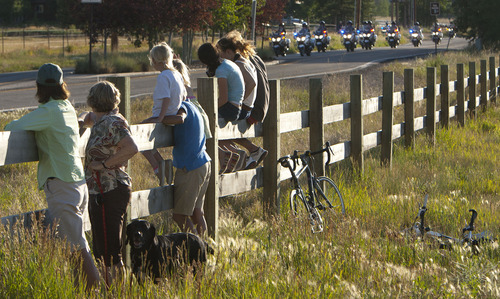 Steve Griffin | The Salt Lake Tribune


People sit on a wood fence as the motorcade of the Vice President of the United States,  Joe Biden, passes them on the Old Ranch Road in Park City, Utah Tuesday July 10, 2012. Bidden was speaking at a fundraiser at the Park City home of John and Kristi Cumming.