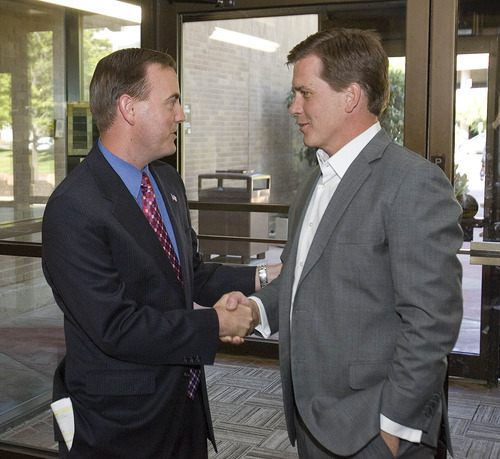 Paul Fraughton | Salt Lake Tribune
Mark Crockett, right, receives a congratulatory handshake from GOP opponent Mike Winder upon arriving at the Salt Lake County Government Center, where a canvass of the June 26 primary election determined that Crockett had won their race for the Republican mayoral nomination by more than 1,000 votes.