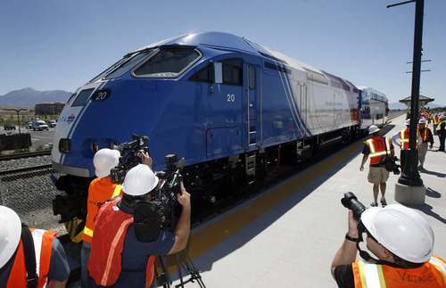Francisco Kjolseth  |  The Salt Lake Tribune
Officials, media and work crews welcome the first FrontRunner train as it arrives in Utah County at the Lehi Station on Monday, June 11, 2012, marking the beginning of the testing process of the new commuter rail line that links Provo to Salt Lake City.