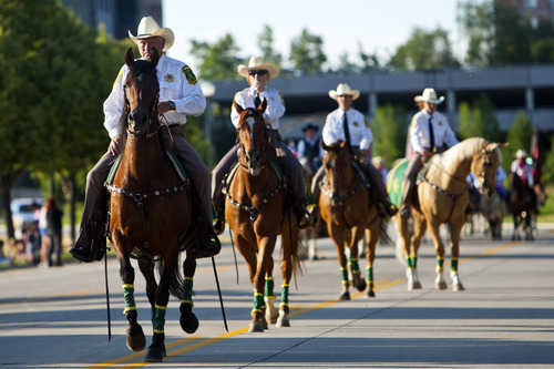 Chris Detrick  |  The Salt Lake Tribune
Members of the Davis County Sheriff's Posse, organized in 1939, ride during the Days of '47 All-Horse Parade Tuesday July 10, 2012.