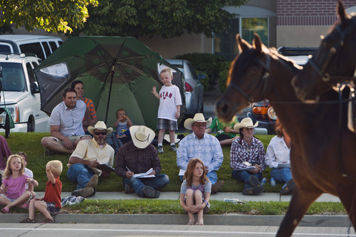 Chris Detrick  |  The Salt Lake Tribune
Spectators watch the Days of '47 All-Horse Parade Tuesday July 10, 2012.