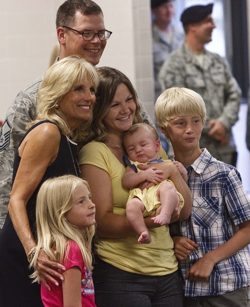 Leah Hogsten  |  The Salt Lake Tribune
Jill Biden is photographed with the Ford family; mom Sarah, dad Ronald, son Damian, 11, daughter Tabitha, 8, and son Knox, 4 months. Biden, wife of U.S. Vice President Joe Biden, met with Utah National Guard soldiers and their families at the Utah Air Guard  Tuesday in Salt Lake City. She's hoping to raise awareness for Joining Forces, a national initiative to support service members and their families.