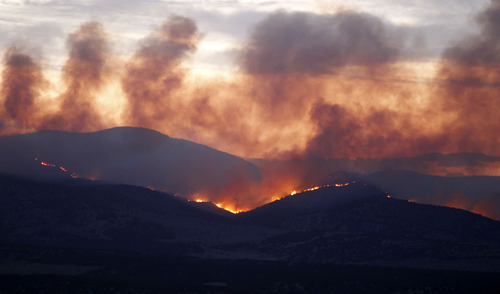 Al Hartmann  |  The Salt Lake Tribune  
Wood Hollow fire continues to burn Sunday night several miles northwest of Fairview.