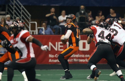 Kim Raff | The Salt Lake Tribune
Utah Blaze quarterback drops in the backfield for a pass during a game against the Cleveland Gladiators at the EnergySolutions Arena in Salt Lake City, Utah on July 13, 2012.