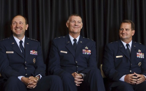 Leah Hogsten  |  The Salt Lake Tribune
Lt. Gen. Bruce A. Litchfield, left, commander of the Air Force Sustainment Center, Maj. Gen. Andrew E. Busch, former Ogden Air Logistics Center commander, and Brig. Gen. H. Brent Baker, the new commander of the Ogden Air Logistics Complex. Restructuring at the Ogden Air Logistics Center at Hill Air Force Base left it with a new name and a new commander Thursday, July 12, 2012. The new Ogden Air Logistics Complex is part of a major reorganization of the Air Force's Materiel Command, which is the service's biggest employer of civilians. The Air Force expects to save $109 million a year by reducing and consolidating overhead.