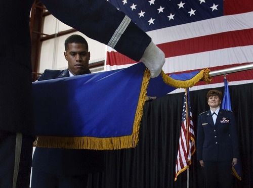 Leah Hogsten  |  The Salt Lake Tribune
Senior Airman Bolivar Belliard retires the flag of the Ogden Air Logistics Center before Gen. Janet C. Wolfenbarger, commander of the Air Force Materiel Command. Restructuring at the Ogden Air Logistics Center at Hill Air Force Base left it with a new name and a new commander Thursday, July 12, 2012. The new Ogden Air Logistics Complex is part of a major reorganization of the Air Force's Materiel Command, which is the service's biggest employer of civilians. The Air Force expects to save $109 million a year by reducing and consolidating overhead.