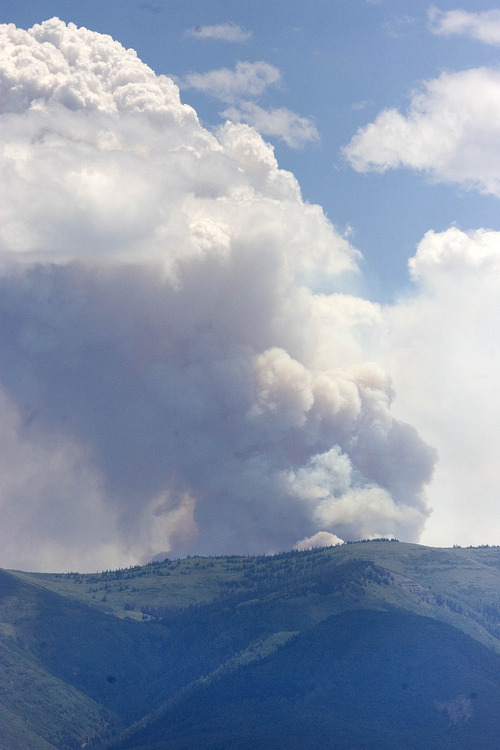 Paul Fraughton | Salt Lake Tribune
The Seeley fire as seen from the command post for the Wood Hollow Fire in Moroni.
 Thursday, June 28, 2012