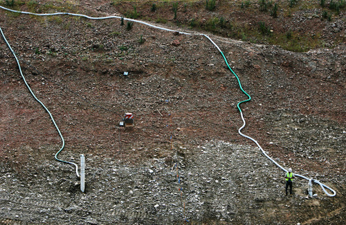 Steve Griffin | The Salt Lake Tribune

Bureau of Reclamation crews are making seismic safety modifications to Echo Dam. Studies indicate that potentially liquefiable materials are present within the dam foundation. Reclamation crews are removing the dirt and replacing it with dense, compacted material.
