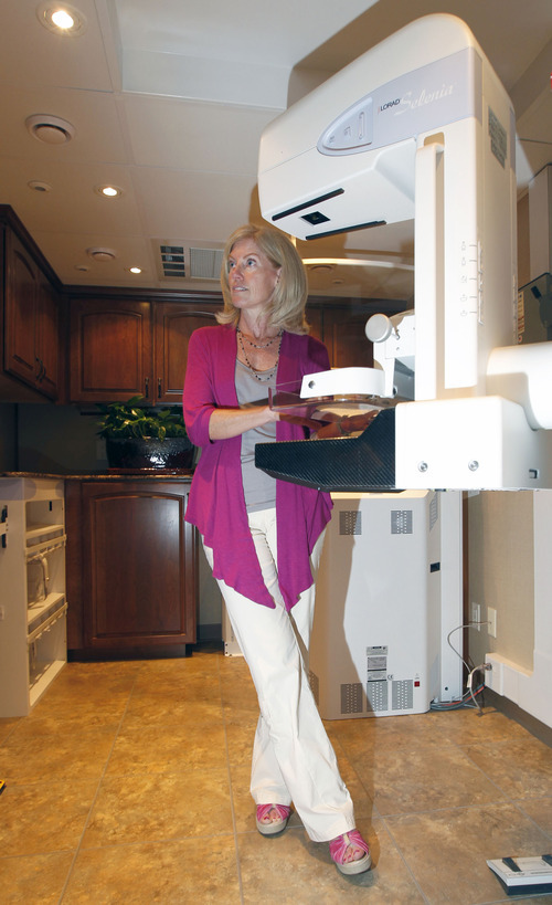 Al Hartmann  |  The Salt Lake Tribune  
Imaging radiologist Catherine Babcook, MD looks at the mamography machine in Mountain Medical's state-of-the-art screening center housed in a 38 foot RV.  The front section is an office-waiting area and the back  houses the mamography equipment.   Mountain Medical is  launching the first ever Mobile Mammography unit in Utah next week.  It will be  staffed by certified mammography technologists. This is a whole new approach to women's healthcare-bringing early breast cancer detection directly to the patient. Companies and organizations will have the ability to request the Mobile Mammography to come directly to their place of business for the benefit of their employees.