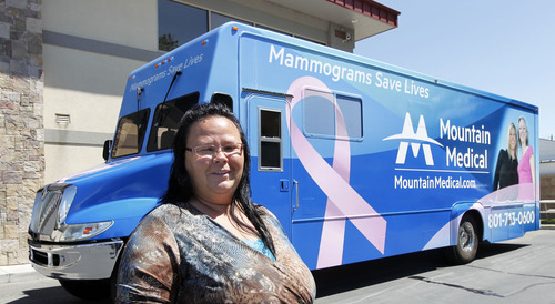 Al Hartmann  |  The Salt Lake Tribune  
Charity Castleberry stands next to  Mountain Medical's state-of-the-art screening center housed in a 38 foot RV.  She will drive the RV and serve as a medical clerk.  She's not worried about driving the large mobile clinic.  She's driven semis.   The front section is an office-waiting area and the back  houses the mamography equipment.   Mountain Medical is  launching the first ever Mobile Mammography unit in Utah next week.  It will be  staffed by certified mammography technologists. This is a whole new approach to women's healthcare-bringing early breast cancer detection directly to the patient. Companies and organizations will have the ability to request the Mobile Mammography to come directly to their place of business for the benefit of their employees.