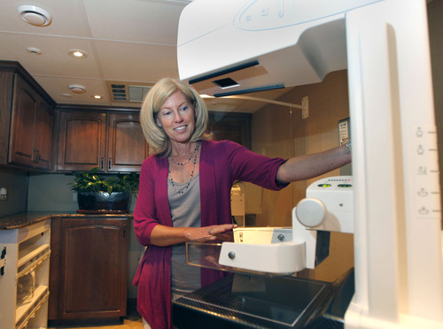 Al Hartmann  |  The Salt Lake Tribune  
Imaging radiologist Catherine Babcook, MD looks at the mamography machine in Mountain Medical's state-of-the-art screening center housed in a 38 foot RV.  The front section is an office-waiting area and the back  houses the mamography equipment.   Mountain Medical is  launching the first ever Mobile Mammography unit in Utah next week.  It will be  staffed by certified mammography technologists. This is a whole new approach to women's healthcare-bringing early breast cancer detection directly to the patient. Companies and organizations will have the ability to request the Mobile Mammography to come directly to their place of business for the benefit of their employees.