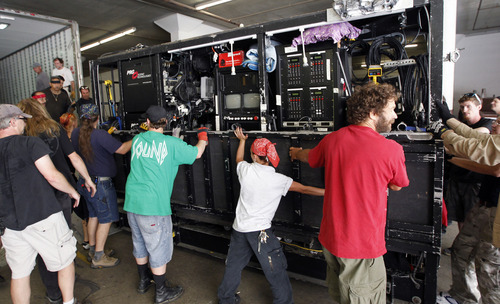 Al Hartmann  |  The Salt Lake Tribune  
Roadies unload sound equipment into the Capitol Theatre on July 17 for the national touring show of 