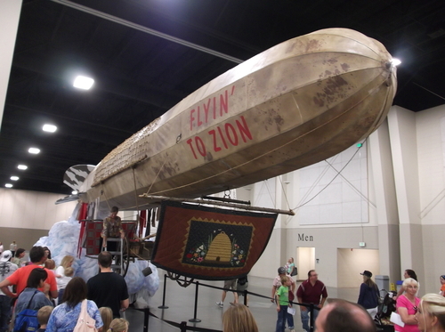 This marvel, the Days of '47 Parade float from the Salt Lake Stake, is an amazing piece of engineering. The blimp juts out far ahead of the float's base, seemingly without support. The secret? The vehicle underneath all the cotton clouds is an articulated forklift. (Photo by Sean P. Means  |  The Salt Lake Tribune)