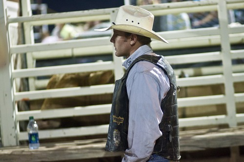 Chris Detrick  |  The Salt Lake Tribune
Tag Elliott, of Thatcher, prepares to ride 30S Monty the Bull during the Dinosaur Roundup Rodeo Friday July 13, 2012. Tag Elliott was ranked 24th in the world when he was injured while attempting to ride a bull named Werewolf at the 2007 Days of '47 rodeo.