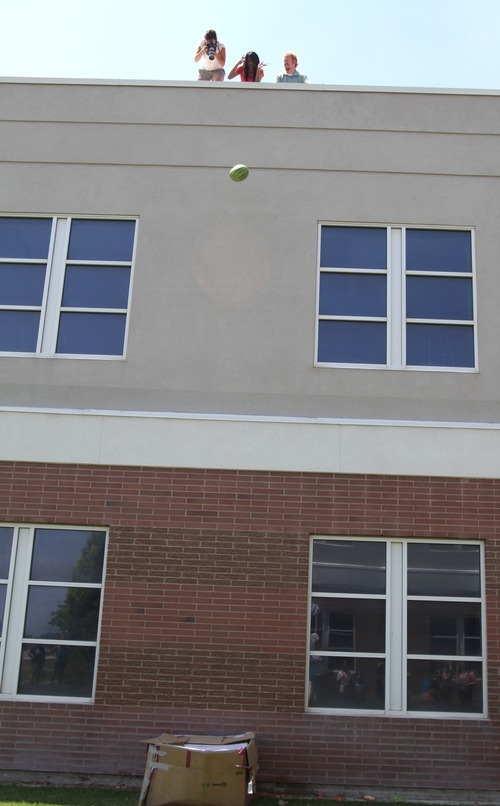 Rick Egan  | The Salt Lake Tribune 

Students from Copper Hills High built devices in an attempt to catch watermelons dropped from the roof of their school as part of a science and physics grant the school received.