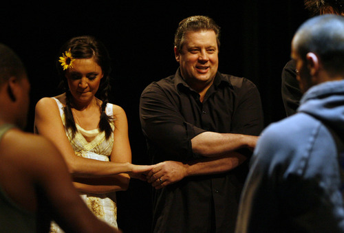 Rick Egan  |  Tribune file photo
Artistic director Derryl Yeager joins hands with dancers in The Odyssey Dance Theatre before their performance at Kingsbury Hall,  Saturday, March 28,  2009