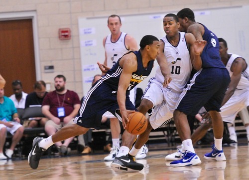 Alec Burks runs into a pick while playing Orlando Johnson, (11) of the Utah Jazz play the Indiana Pacers during the Orlando Summer League games Thursday, July 12, 2012 in Orlando, Florida.  (Photo by Roberto Gonzalez|Special to the Tribune)