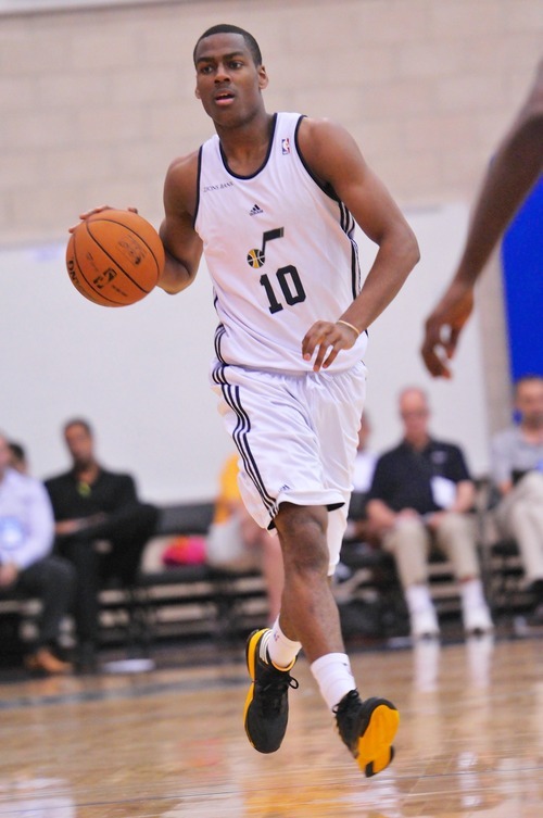Alec Burks (10), of the Utah Jazz brings the ball upcourt against the Indiana Pacers during the Orlando Summer League games Thursday, July 12, 2012 in Orlando, Florida.  (Photo by Roberto Gonzalez|Special to the Tribune)