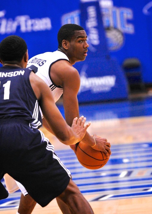 Alec Burks (10), of the Utah Jazz is defended by Orlando Johnson (11) of the Indiana Pacers during the Orlando Summer League games Thursday, July 12, 2012 in Orlando, Florida.  (Photo by Roberto Gonzalez|Special to the Tribune)