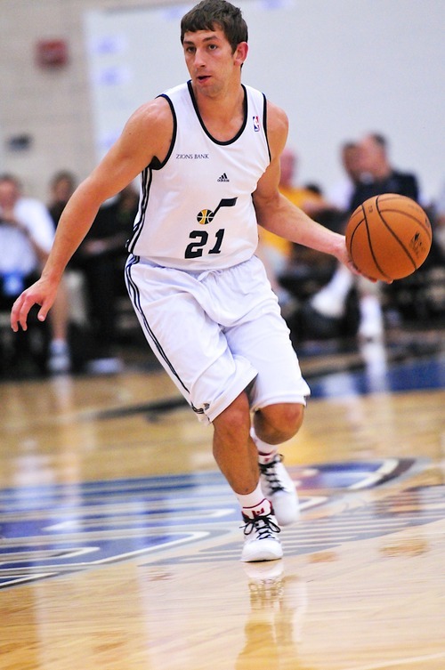 Michael Stockton, 21, of the Utah Jazz brings the ball upcourt against the Indiana Pacers during the Orlando Summer League games Thursday, July 12, 2012 in Orlando, Florida.  (Photo by Roberto Gonzalez|Special to the Tribune)