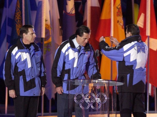 Leah Hogsten  |  Tribune file photo
Mitt Romney, head of the Salt Lake Organizing Committee, receives a medal from IOC President Jacques Rogge during the Closing Ceremony at Rice-Eccles Stadium in February 2002.