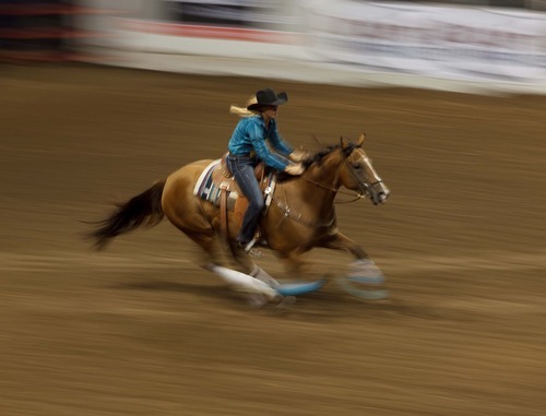 Trent Nelson  |  The Salt Lake Tribune
Randa Kellogg competes in the Barrel Racing competition at the Days of '47 Rodeo at the Maverik Center in West Valley City, Utah on Tuesday, July 24, 2012.