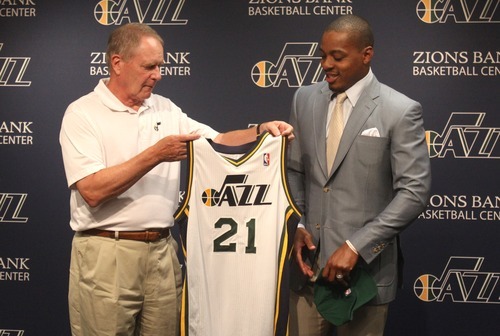 Rick Egan  | The Salt Lake Tribune 

Utah Jazz general manager, Kevin O' Connor presents Randy Foye with his new Jersey, during a press conference at Zion's Bank Basketball Center, Thursday, July 26, 2012.
