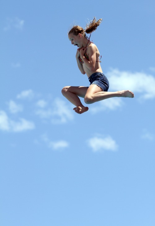 Rick Egan  | The Salt Lake Tribune
A brave girl screams as she leaps off of the 10-meter platform high dive at Oquirrh Park Fitness Center in Kearns.