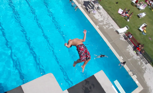 Rick Egan  | The Salt Lake Tribune 

Pailate Makona does a back flip off one of the diving platforms at Oquirrh Park Fitness Center in Kearns, Thursday, July 19, 2012.