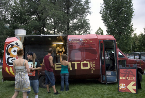 Kim Raff | The Salt Lake Tribune
People line up to order food at the Bento Truck during the Twilight Concert Series at Pioneer Park in Salt Lake City on July 19, 2012.