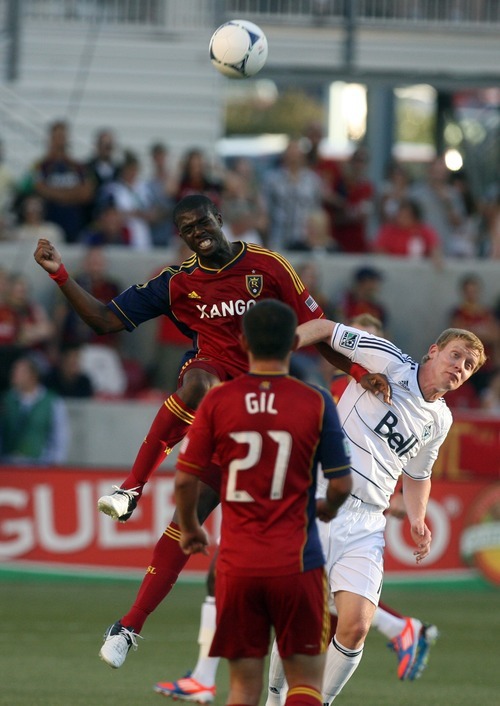 Kim Raff | The Salt Lake Tribune
Real Salt Lake player (left) Kwame Watson-Siriboe and Vancouver player Barry Robson battle for a head ball at Rio Tinto Stadium in Sandy, Utah on July 27, 2012.