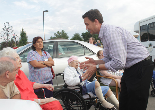 Rick Egan  | The Salt Lake Tribune 

Legacy Village administrator, Ryan Eggelston talks to residents out side the care center in Kearns, Monday, July 30, 2012.  Many of the residents were taken in a van to the Legacy House in Taylorsville for the night,