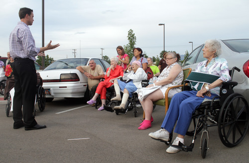 Rick Egan  | The Salt Lake Tribune 

Legacy Village administrator, Ryan Eggelston talks to residents out side the care center in Kearns, Monday, July 30, 2012.  Many of the residents were taken in a van to the Legacy House in Taylorsville for the night,