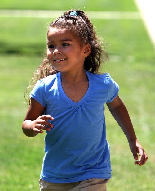 Rick Egan  |  The Salt Lake Tribune 
Josie Despain runs in a park in Ogden Friday, July 20, 2012.   Jessalyn Speight placed Josie, born four years ago, with an adoptive couple from Wyoming. They have developed a warm, open relationship.