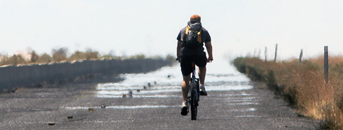 Steve Griffin | The Salt Lake Tribune

A biker braves the hot weather as heat waves shimmer from the asphalt on the frontage road next to I-80 west bound near Saltair in Salt Lake City on Monday, July 9, 2012.