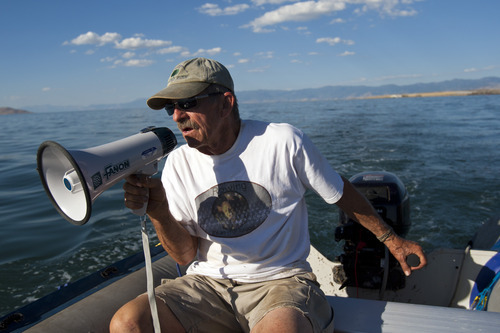 Chris Detrick  |  The Salt Lake Tribune
Great Salt Lake Rowing president Michael Spackman calls out instructions to rowing students near the Great Salt Lake Marina Tuesday July 17, 2012.