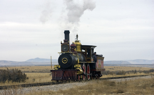 Tribune file photo
The Union Pacific steam locomotive 199 rolls down the track to the Golden Spike National Historic Site visitor center in northwestern Utah.