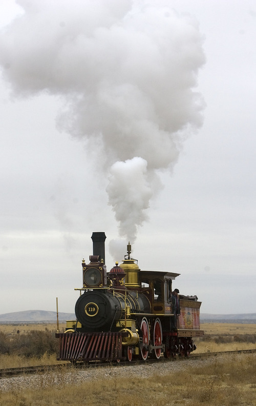 Tribune file photo
The Union Pacific steam locomotive 199 rolls down the track to the Golden Spike National Historic Site visitor center in northwestern Utah.