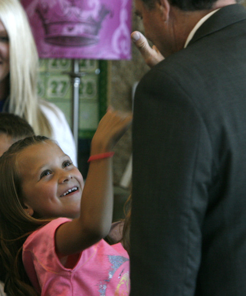Rick Egan  | The Salt Lake Tribune 

Second Grader, Sydnee Hall high-five's Gov. Herbert after he read to the second grade students at Foxboro Elementary, in North Salt Lake, Tuesday, July 31, 2012.  Gov. Herbert and leaders of Prosperity 2020 announced an initiative to get more business volunteers in schools.
